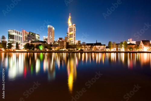 Frankfurt skyline skyscrapers at night reflecting in the river