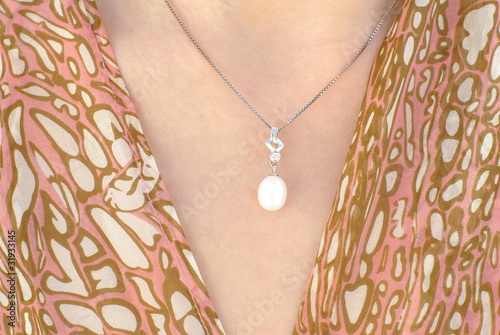 White pearl pendant on a silver chain