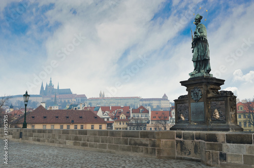 Statue in Charles Bridge, Prague Castle sunrise view, Prague