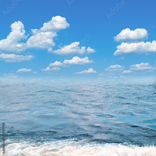 Sea and blue cloudy sky