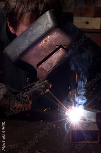 A factory welder at work