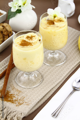 Glass with sweet banana pudding dessert