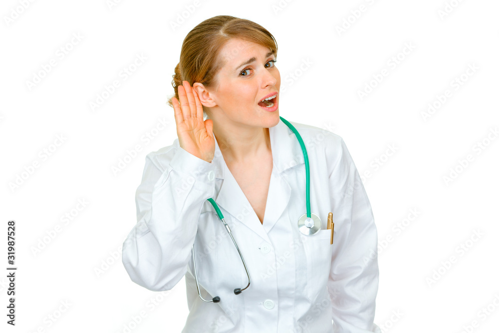 Speak loud! Doctor woman holding hand at ear and listening Speak loud! Doctor woman holding hand at ear and listening