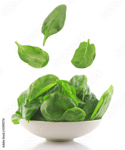 fresh spinach in a white bowl