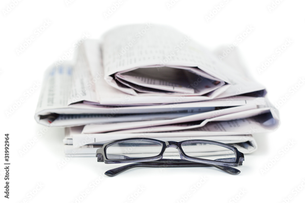 Newspapers and black glasses Newspapers and black glasses