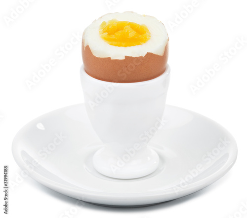 boiled egg in egg cup isolated