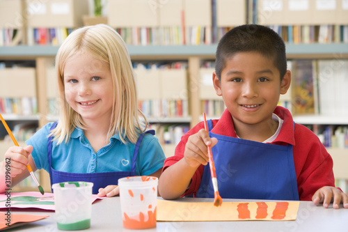 Kindergarten children painting photo