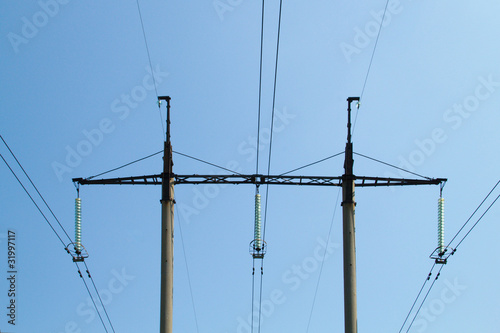 Power line against the blue sky photo