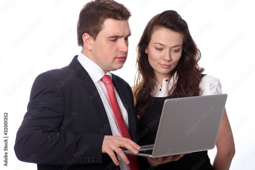 Closeup of a happy casual couple looking at laptop