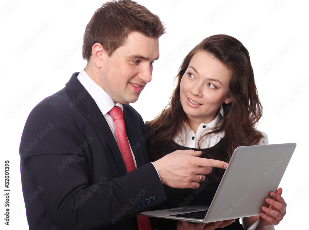 Closeup of a happy casual couple looking at laptop Closeup of a happy casual couple looking at laptop