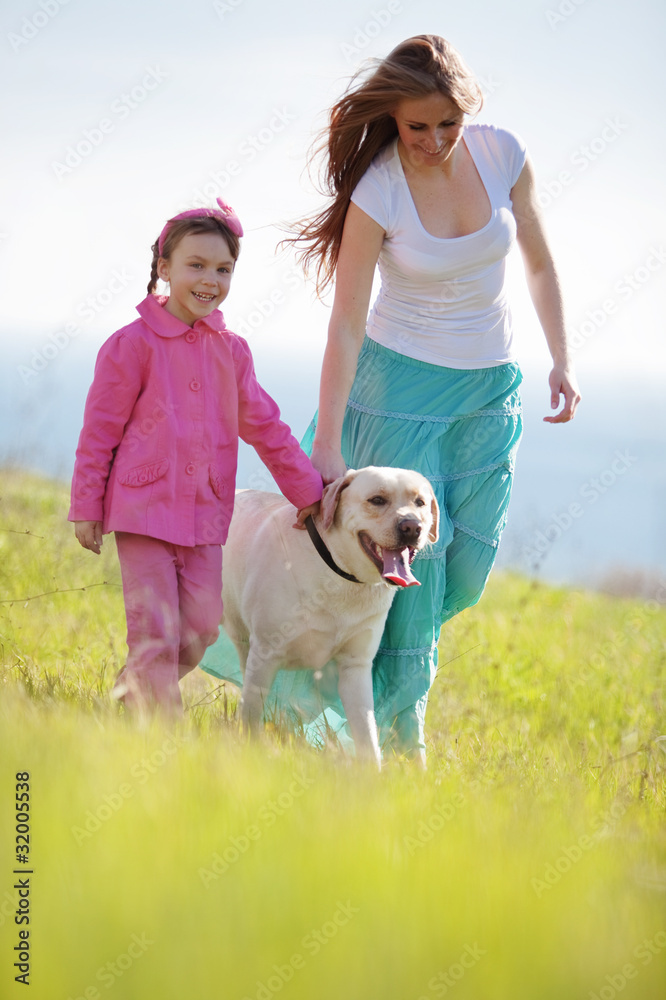 Happy family walking with dog Happy family walking with dog