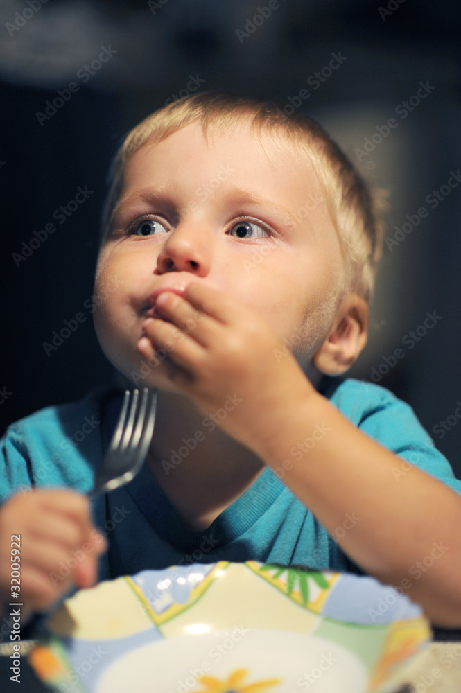 Cute boy with fork and plate Cute boy with fork and plate