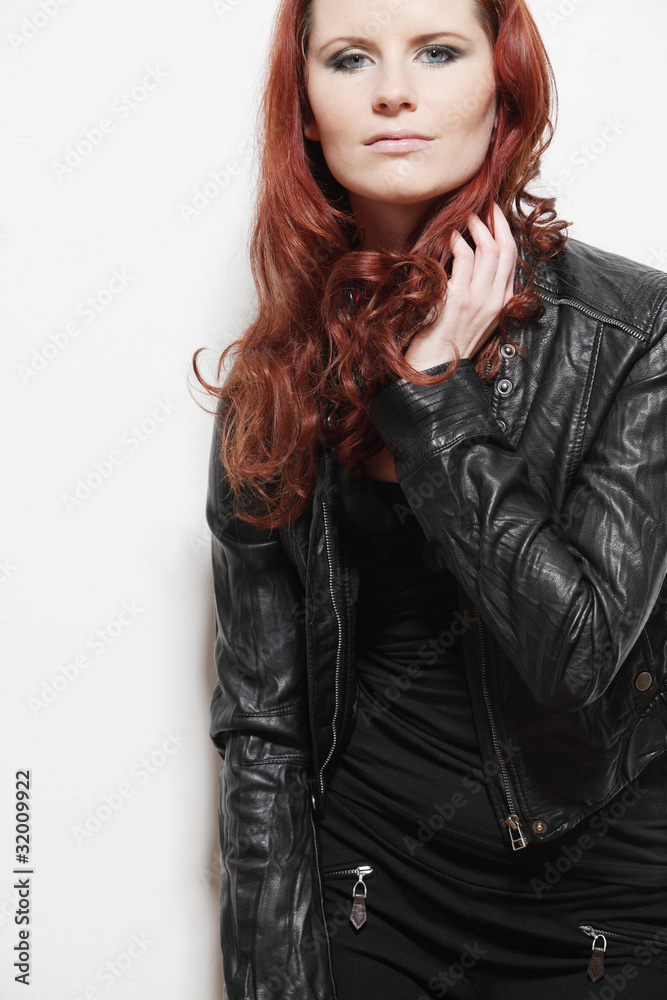 Fototapeta premium Beautiful european woman with long curly hair.