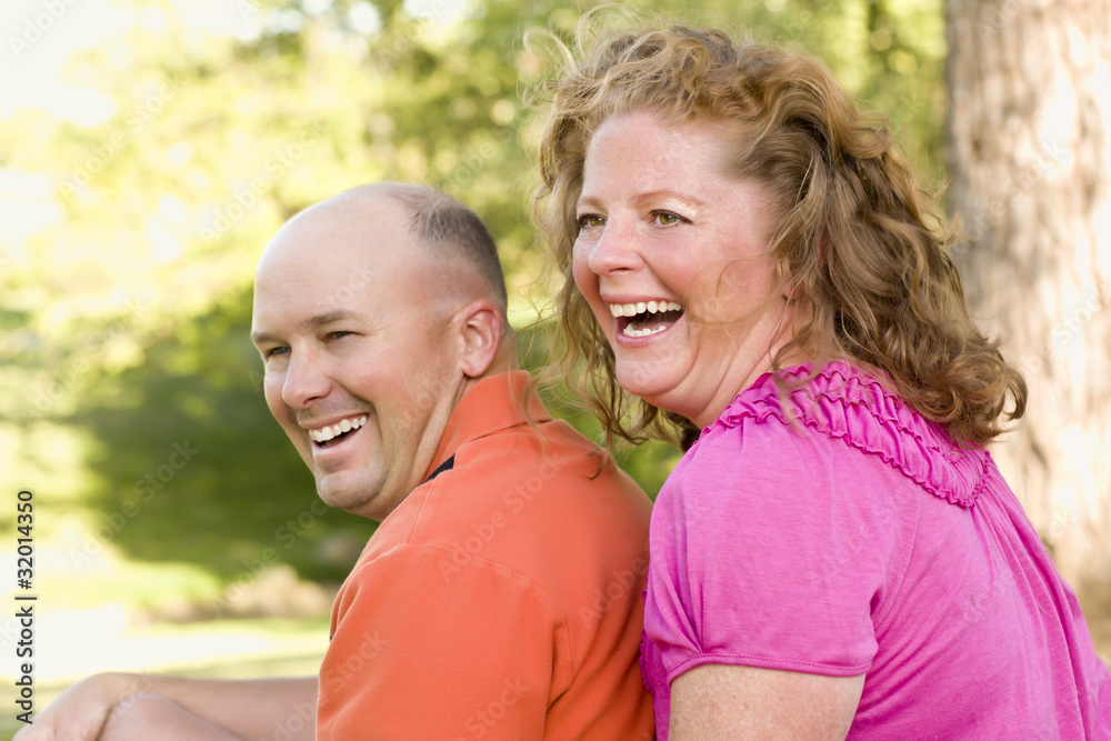 Happy Attractive Couple Laughing in Park