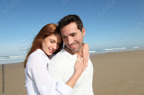Happy married couple at the beach