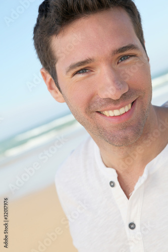 Portrait of handsome man at the beach