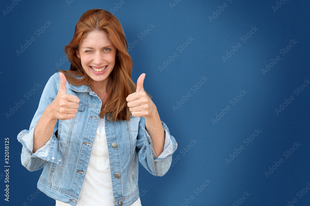 Portrait of beautiful woman on blue background