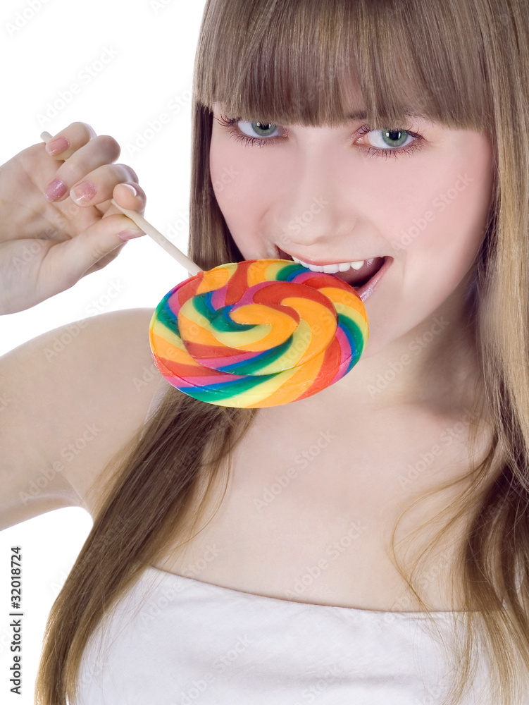 Bright picture of hungry blonde with color lollipop