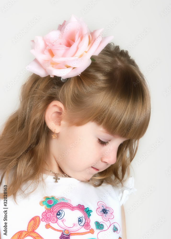 timid girl with a flower in hair timid girl with a flower in hair