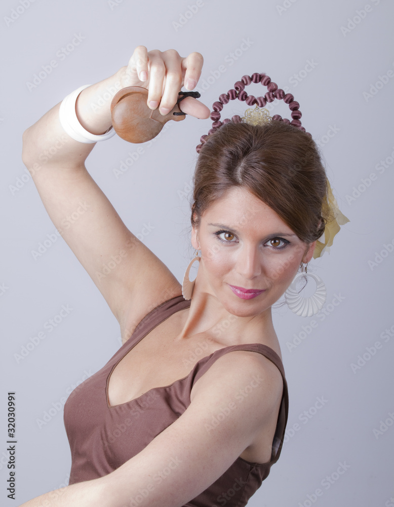 Mujer española en traje de faralaes tocando las castañuelas Stock Photo |  Adobe Stock