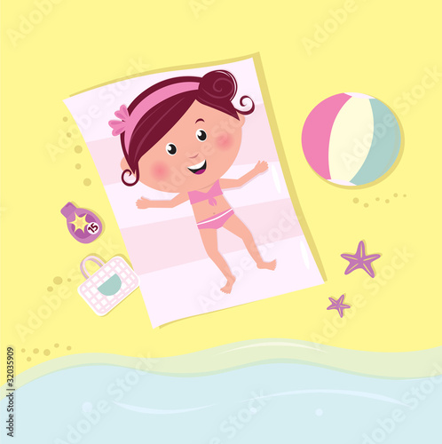 Happy smiling girl lying on the beach and sunbathing