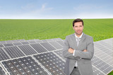 Businessman standing by photovoltaic installation