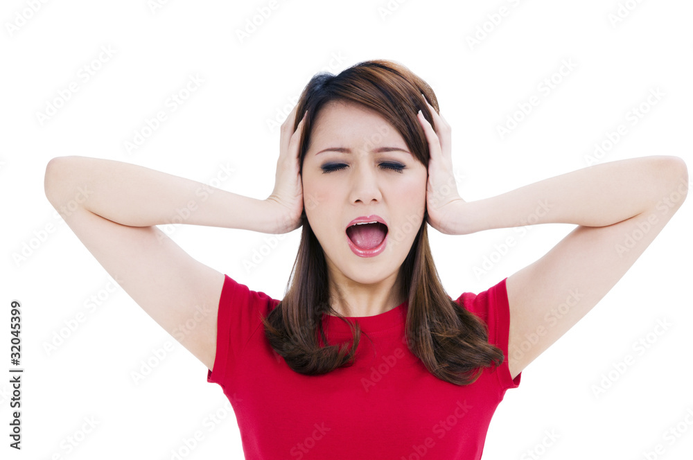 Frustrated young woman covering her ears with hands Frustrated young woman covering her ears with hands
