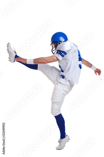 American football player kicking