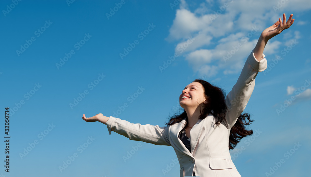 The happy attractive woman with the lifted hands The happy attractive woman with the lifted hands