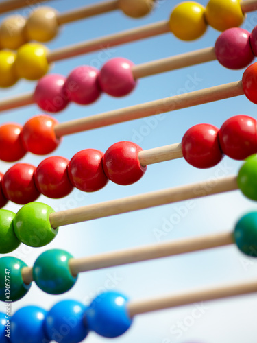 Children abacus in front of blue sky photo