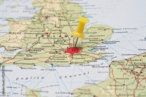 Push pin pointing at London, England on a map