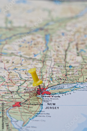 Push pin pointing at New York, United States on a map
