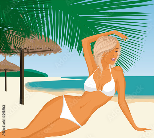 Young woman laying on the beach