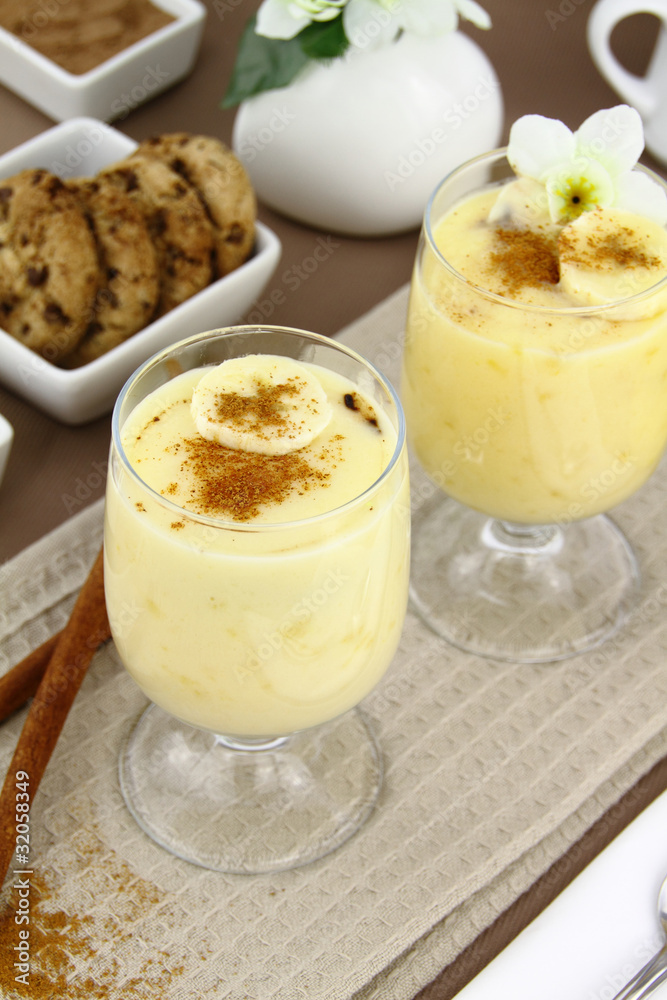Glass with sweet banana pudding dessert Glass with sweet banana pudding dessert