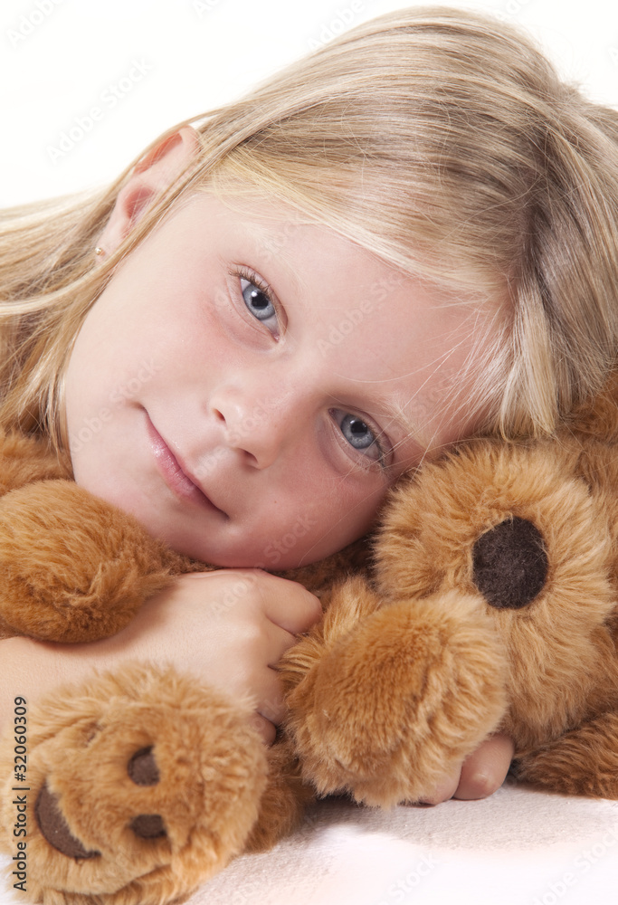 Angelic little girl with her teddy bear on white. Angelic little girl with her teddy bear on white.