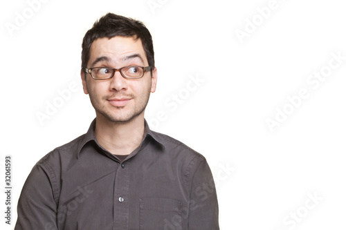 Young man looking at copyspace surprised or satisfied