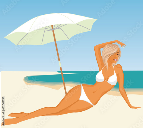 Young woman laying on the beach