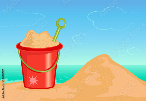 Bucket of sand on the beach