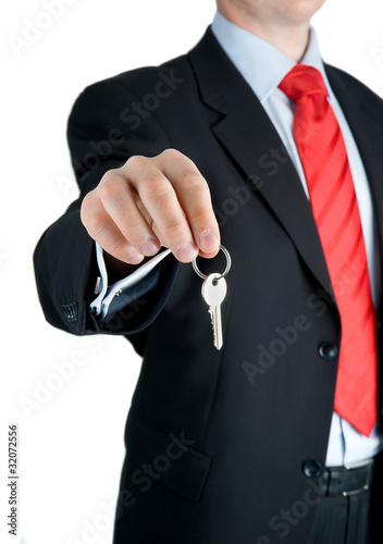 Businessman offering key to Your dream ...