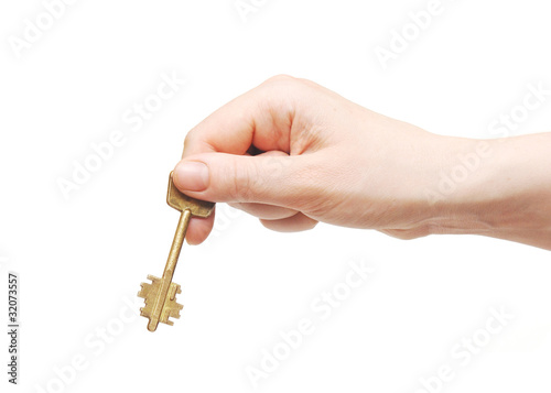 Hand and key isolated on white background