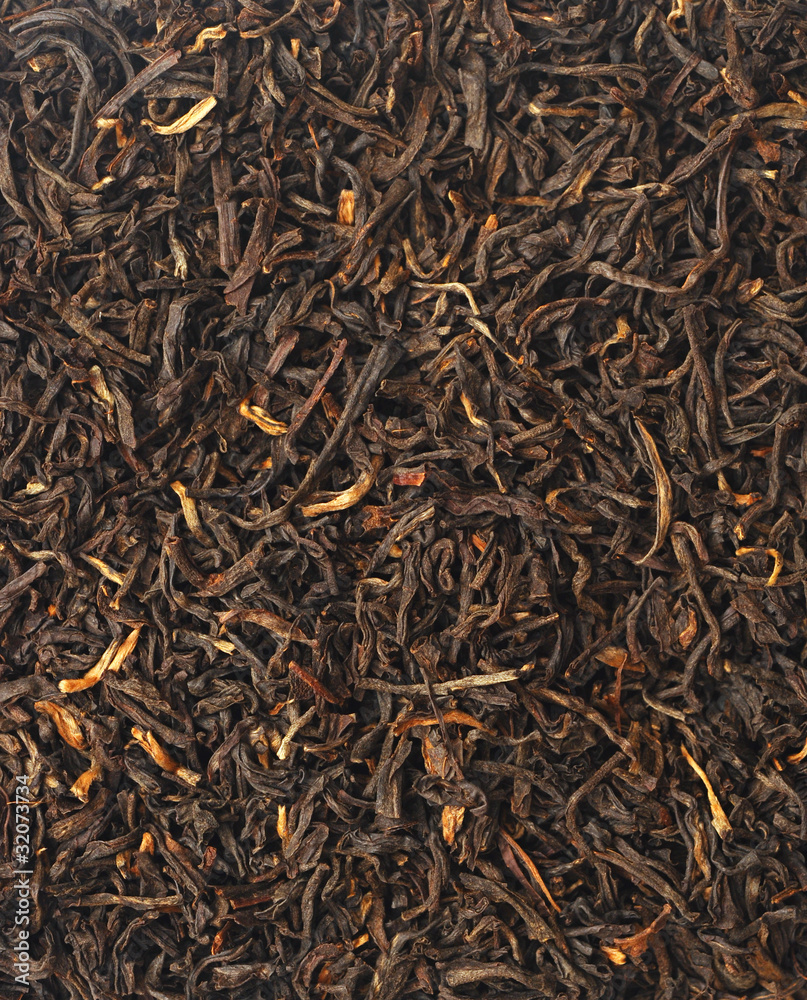 Handful of black tea leaves on white background Handful of black tea leaves on white background