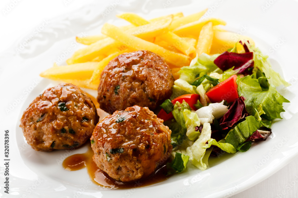Roasted meatballs, chips and vegetable salad Roasted meatballs, chips and vegetable salad