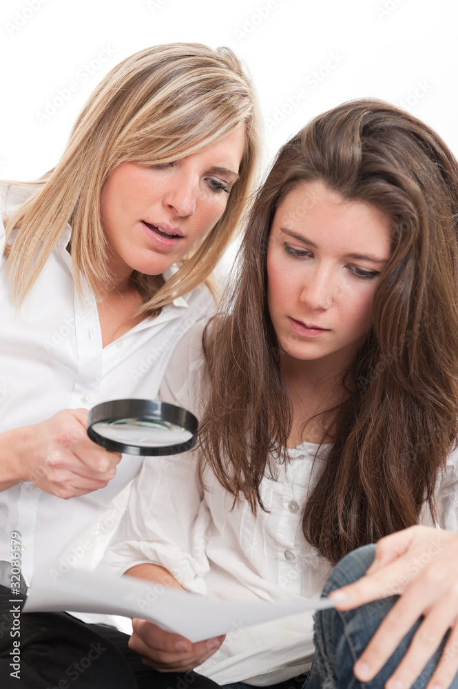 Girls examining document Girls examining document