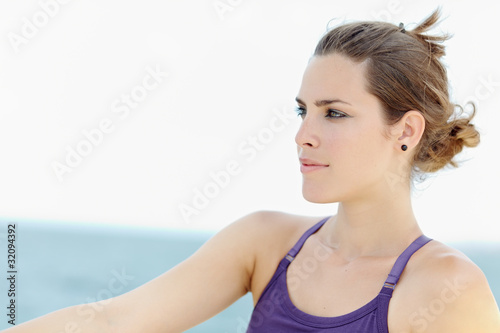 young beautiful woman smiling and looking away