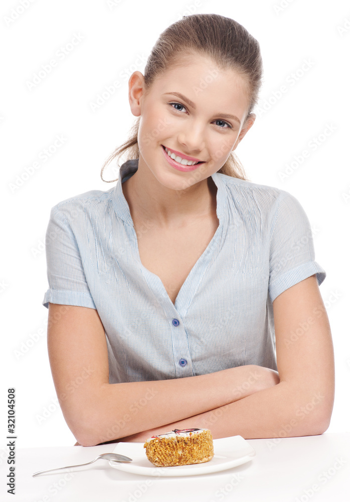 Pretty young woman eating cake. Isolated Pretty young woman eating cake. Isolated