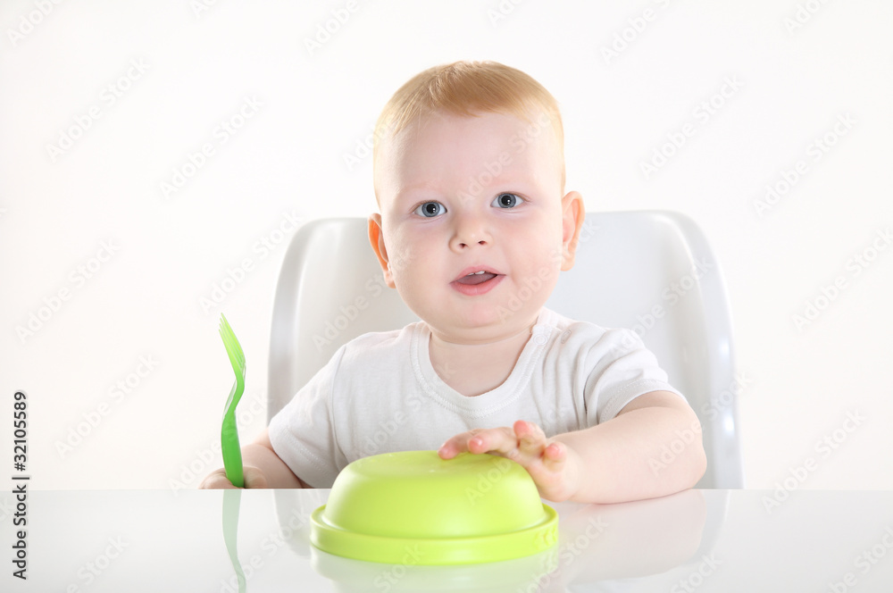 child is sitting at the table child is sitting at the table