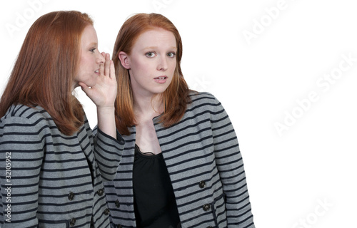 Woman whispering a secret