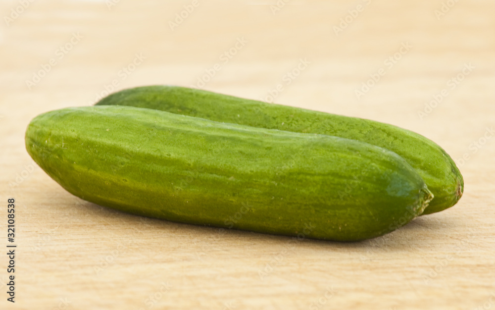 cucumbers with pimples on kitchen board cucumbers with pimples on kitchen board