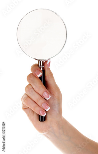 Woman hand with magnifier