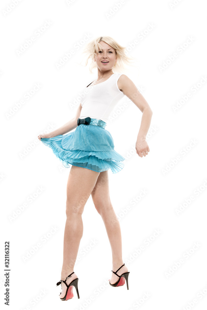The young blonde in a blue skirt on a white background The young blonde in a blue skirt on a white background